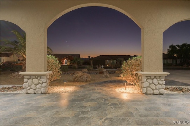 view of patio terrace at dusk