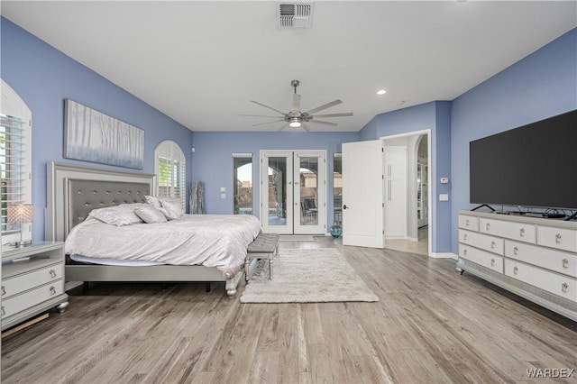 bedroom with visible vents, a ceiling fan, access to outside, french doors, and light wood finished floors