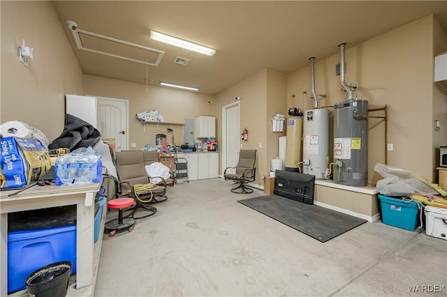 garage with gas water heater and visible vents