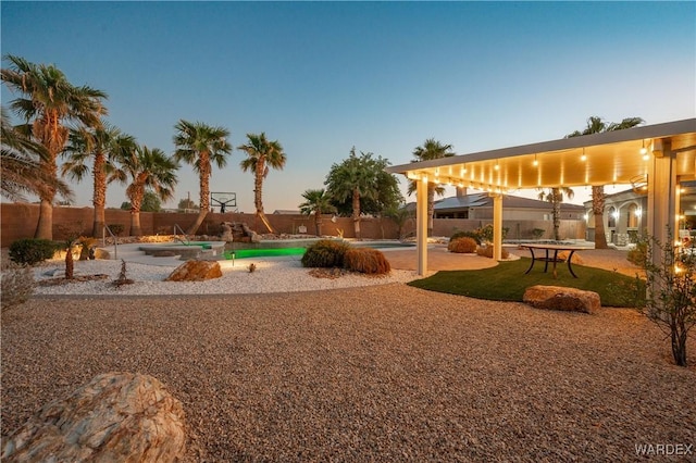 view of play area featuring a fenced in pool, a patio, and fence