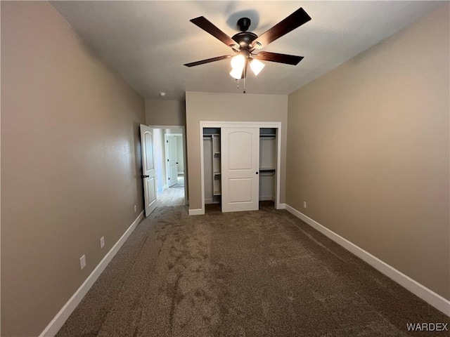 unfurnished bedroom featuring carpet floors, a closet, baseboards, and a ceiling fan