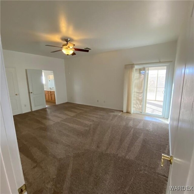 unfurnished room featuring ceiling fan, carpet, and visible vents