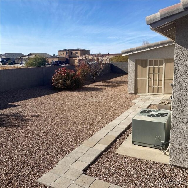 view of yard featuring a patio area and a fenced backyard