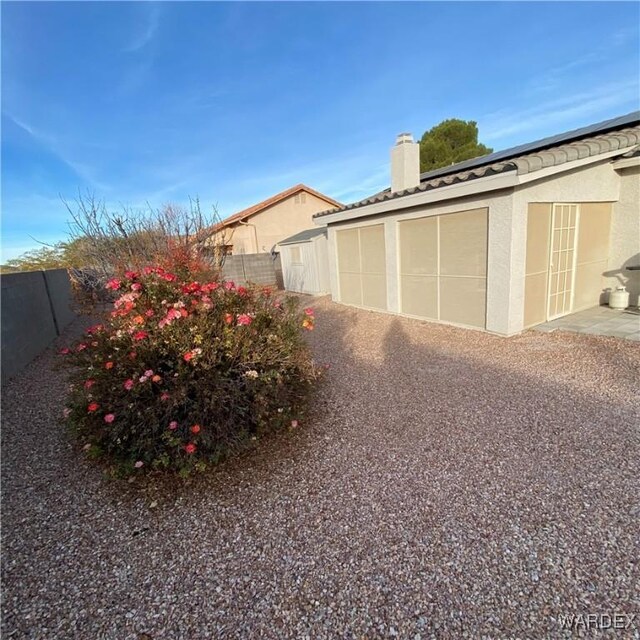 garage featuring fence