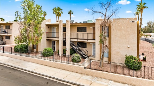 1280 Mohave Dr Unit 28, Bullhead City, AZ 86442 - view of building exterior with stairs and fence
