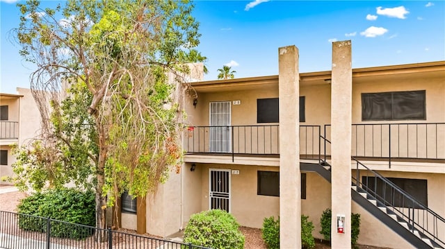 1280 Mohave Dr Unit 28, Bullhead City, AZ 86442 - view of building exterior with stairway and fence
