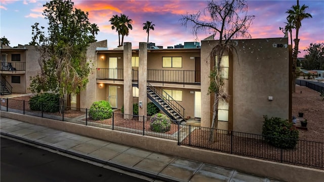 1280 Mohave Dr Unit 28, Bullhead City, AZ 86442 - view of building exterior featuring stairs and fence