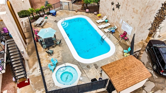 1280 Mohave Dr Unit 28, Bullhead City, AZ 86442 - community pool featuring a patio, fence, and a hot tub