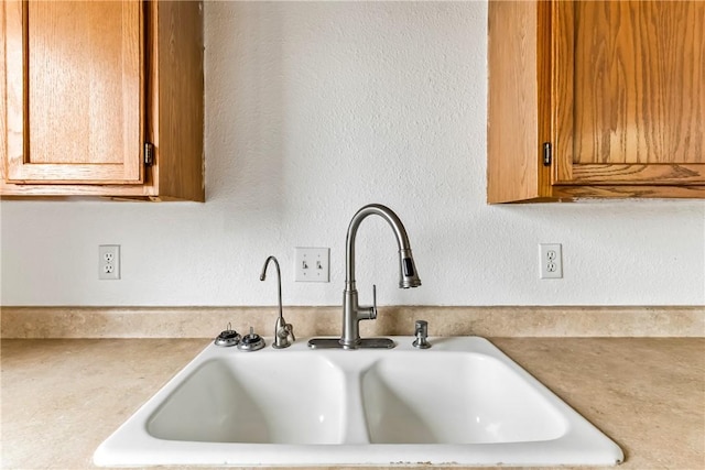 1280 Mohave Dr Unit 28, Bullhead City, AZ 86442 - detailed view of a sink, brown cabinetry, and light countertops
