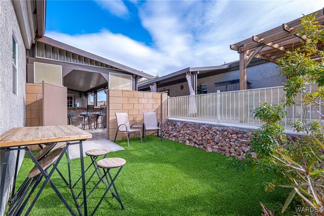 view of yard featuring an outdoor bar and a pergola