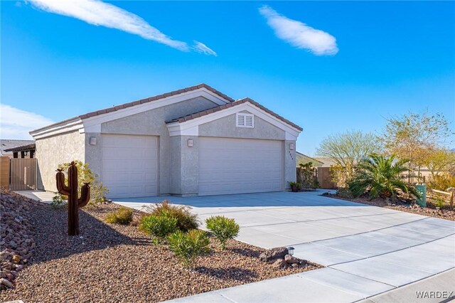 exterior space featuring driveway and fence