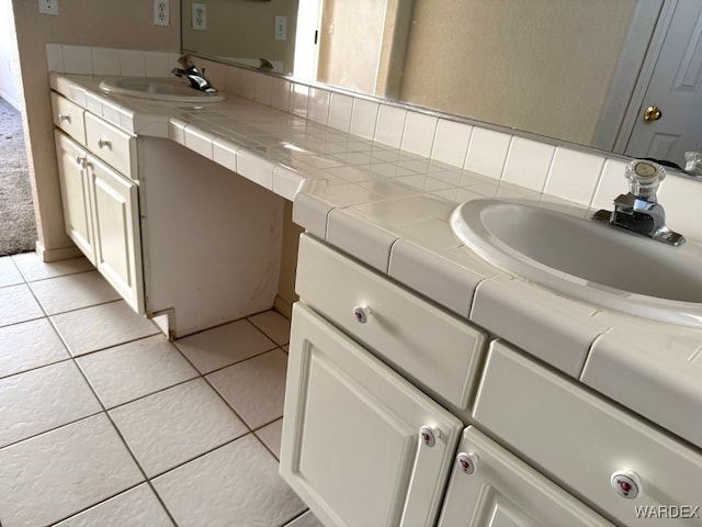 bathroom with vanity and tile patterned floors