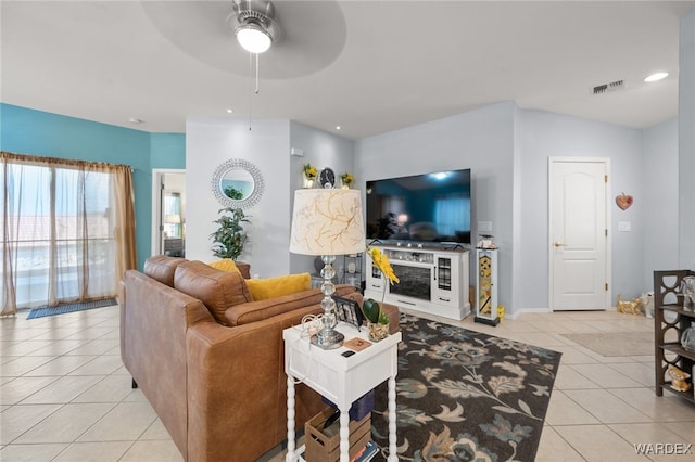 living area featuring a ceiling fan, recessed lighting, visible vents, and light tile patterned floors