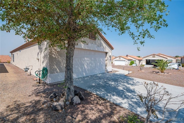 view of home's exterior featuring a garage and stucco siding