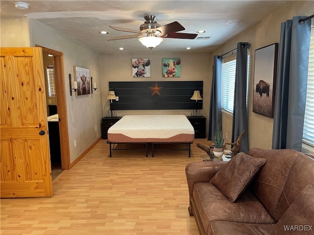 bedroom with light wood-style floors, baseboards, visible vents, and recessed lighting