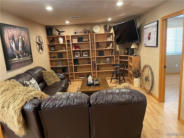 sitting room with recessed lighting, visible vents, light wood-style flooring, and baseboards