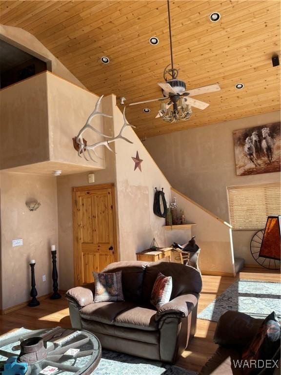 living room with high vaulted ceiling, light wood finished floors, wooden ceiling, and recessed lighting