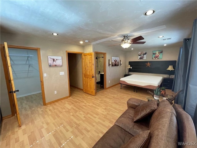 bedroom with baseboards, visible vents, a ceiling fan, light wood-style floors, and recessed lighting