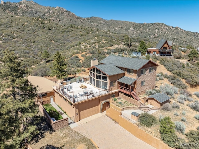 birds eye view of property with a mountain view