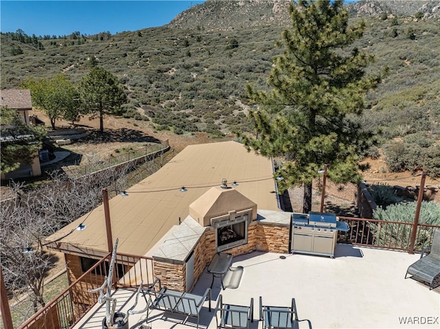 birds eye view of property with a mountain view