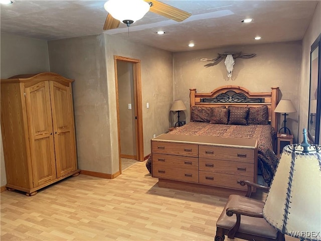 bedroom with ceiling fan, light wood finished floors, recessed lighting, and baseboards