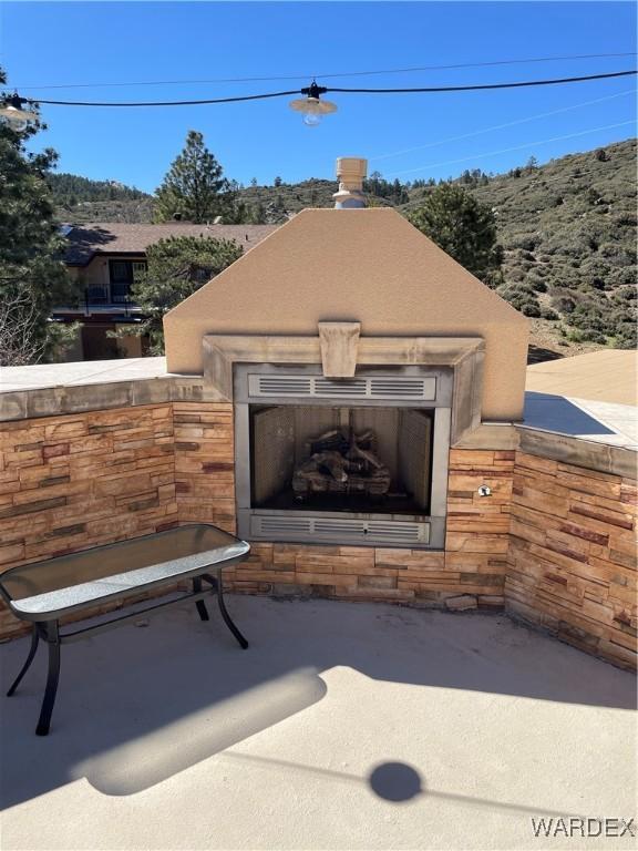 exterior space featuring exterior fireplace