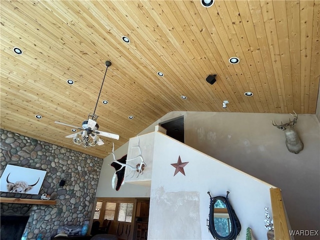 room details featuring recessed lighting, a fireplace, wooden ceiling, and a ceiling fan