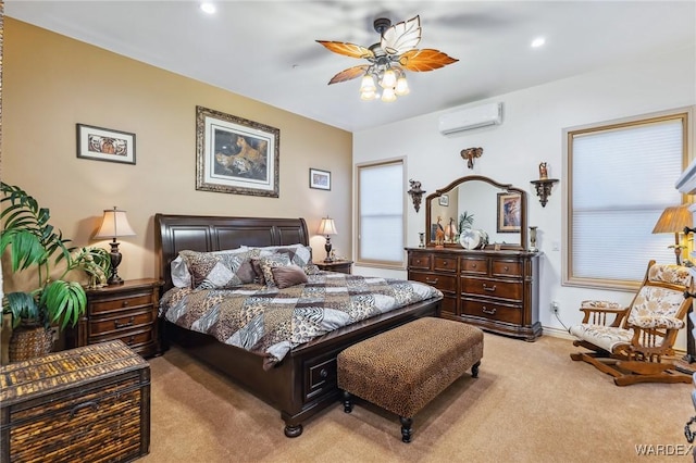 bedroom with recessed lighting, light colored carpet, ceiling fan, a wall mounted air conditioner, and baseboards