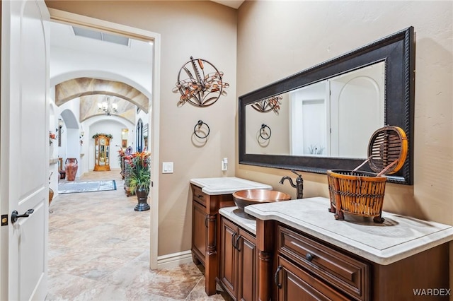 bathroom with visible vents, vanity, and baseboards