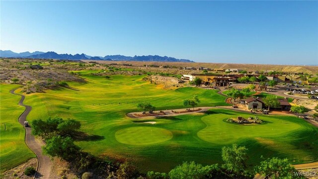 surrounding community featuring golf course view, a residential view, and a mountain view