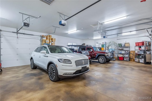 parking garage with visible vents and a garage door opener