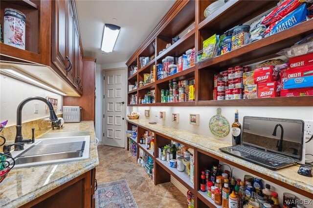 pantry featuring a sink