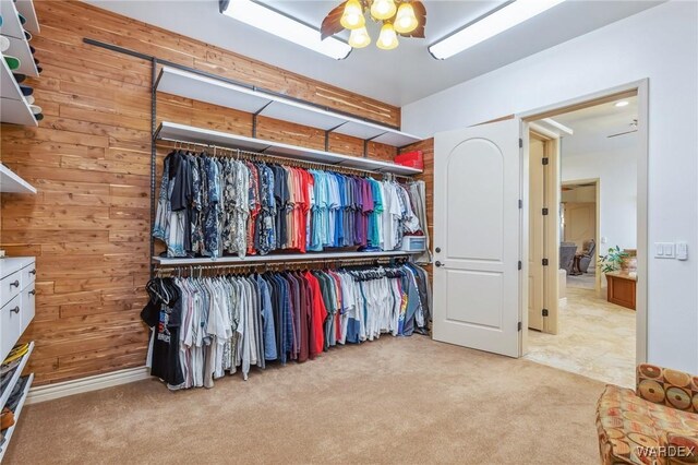 spacious closet with light colored carpet