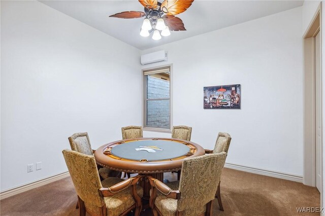 dining space featuring ceiling fan, an AC wall unit, carpet, and baseboards