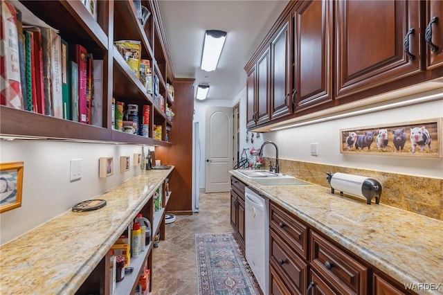 kitchen with dishwasher, open shelves, a sink, and light stone countertops