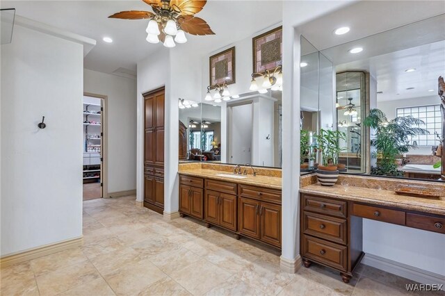 full bathroom with a ceiling fan, recessed lighting, and vanity