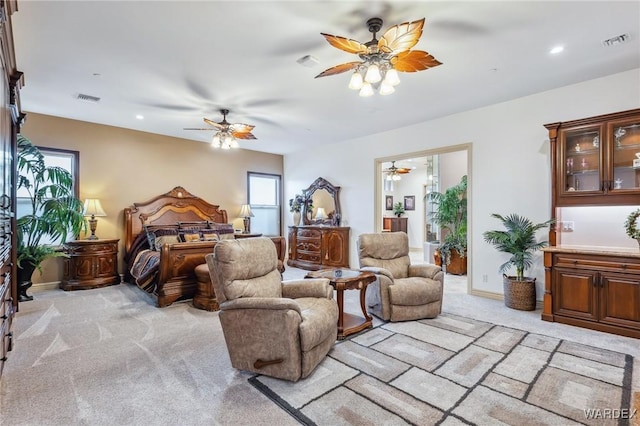 bedroom featuring recessed lighting, visible vents, light carpet, and baseboards