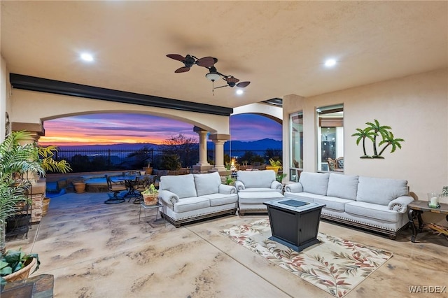 view of patio with ceiling fan and outdoor lounge area