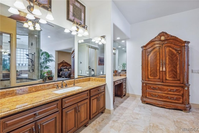 bathroom featuring ensuite bath and vanity