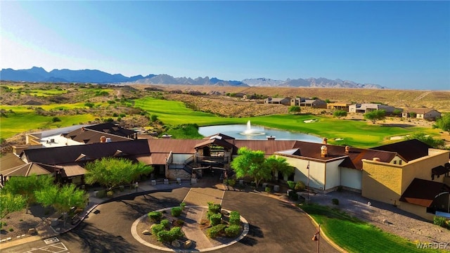 bird's eye view featuring golf course view and a water and mountain view