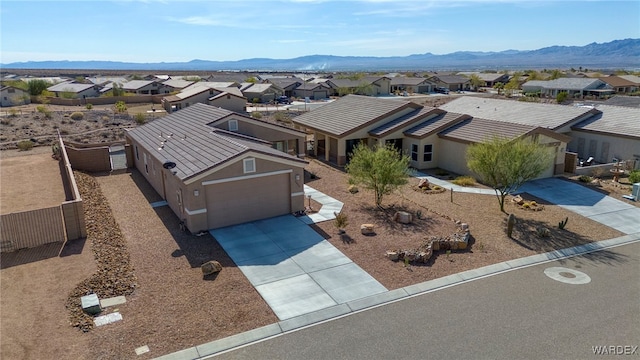 birds eye view of property featuring a mountain view and a residential view