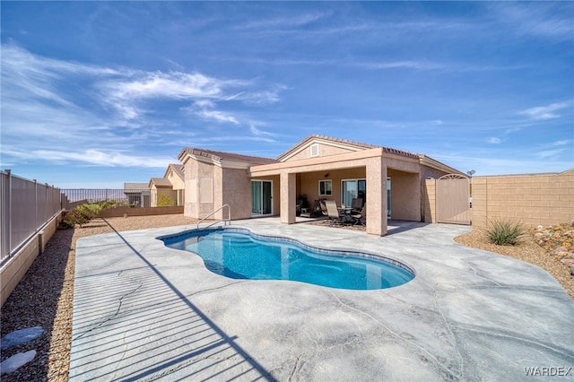 view of pool featuring a gate, a fenced backyard, and a patio