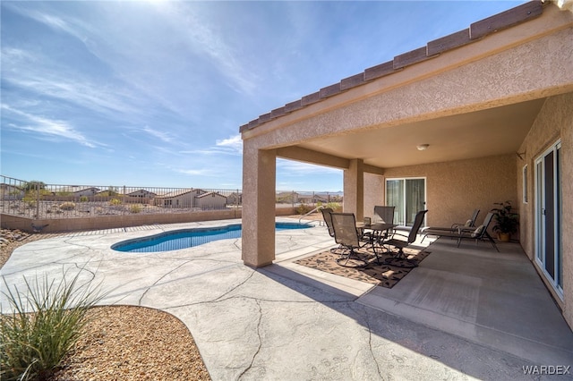 view of swimming pool featuring a patio area, a fenced backyard, and a fenced in pool