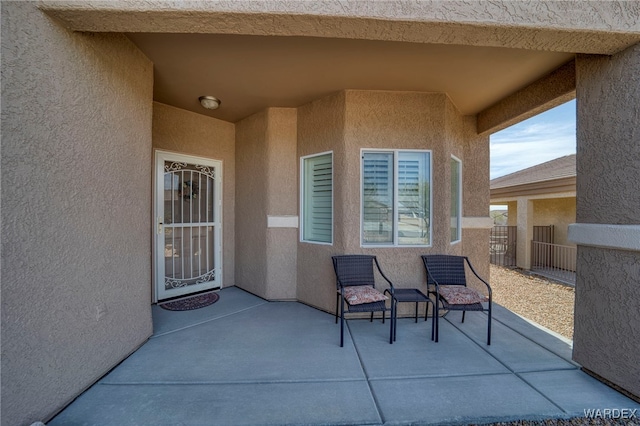 view of patio featuring fence