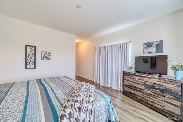 bedroom with light wood-style flooring