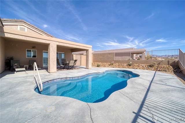 view of pool featuring a fenced backyard and a patio