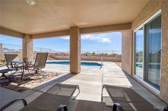 view of patio / terrace with a fenced backyard and a fenced in pool