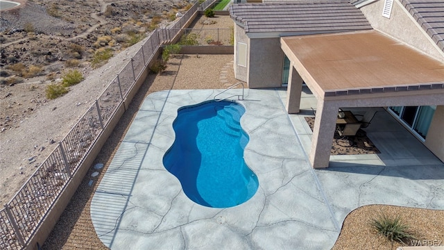 view of pool with a fenced backyard, a fenced in pool, and a patio