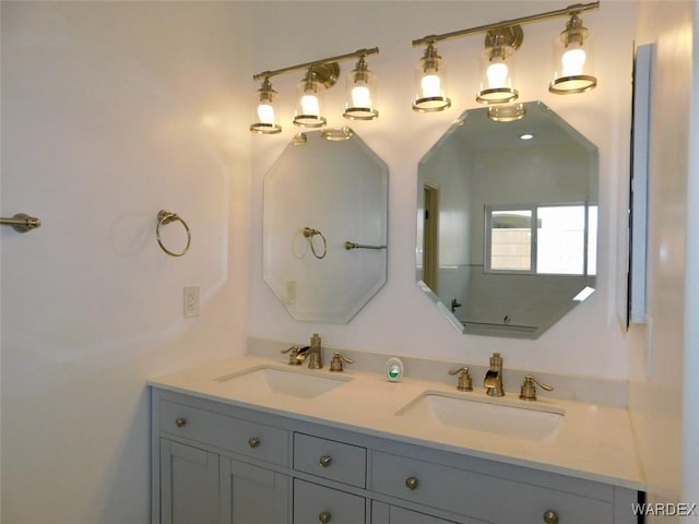 bathroom with double vanity and a sink