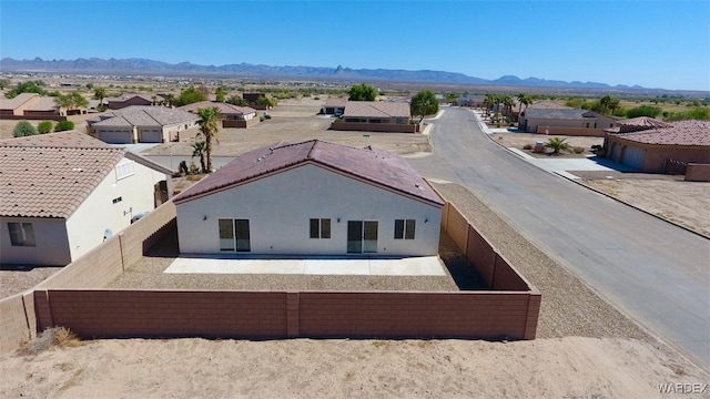 bird's eye view featuring a residential view and a mountain view